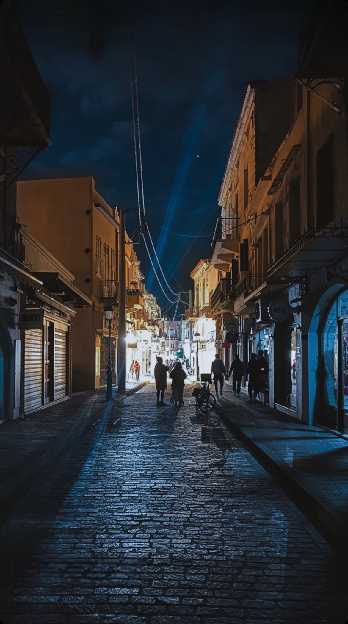 Street of Old Town Rethymno Crete during nightime quiet with some lights in the distance