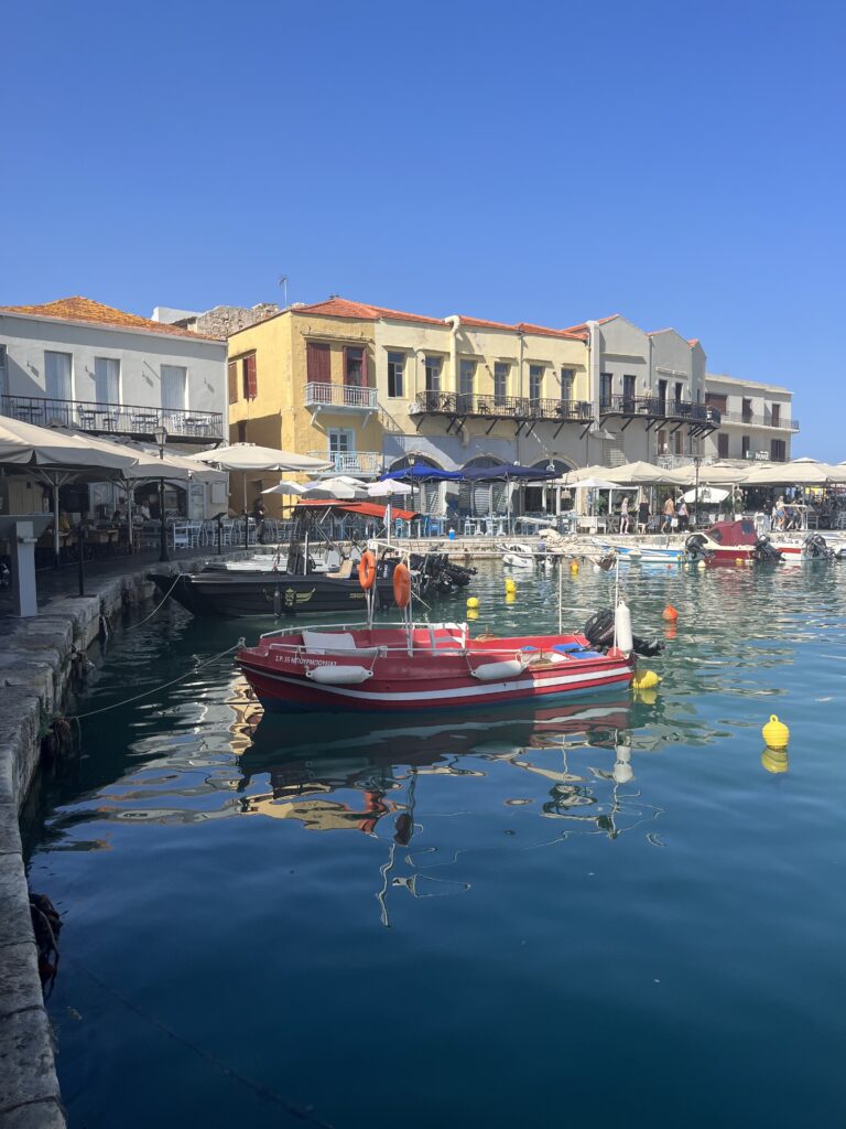 Image of boat at Venetian Harbor in Rethymno, Crete by restaurants