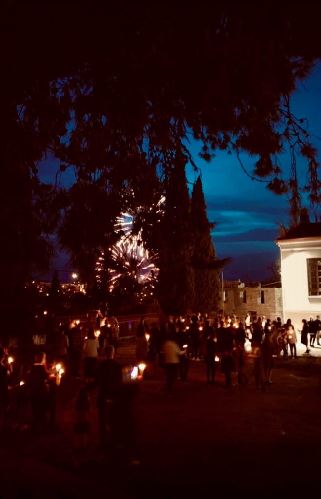 Holy Saturday Resurrection Service outside with fireworks and churchgoers with candles