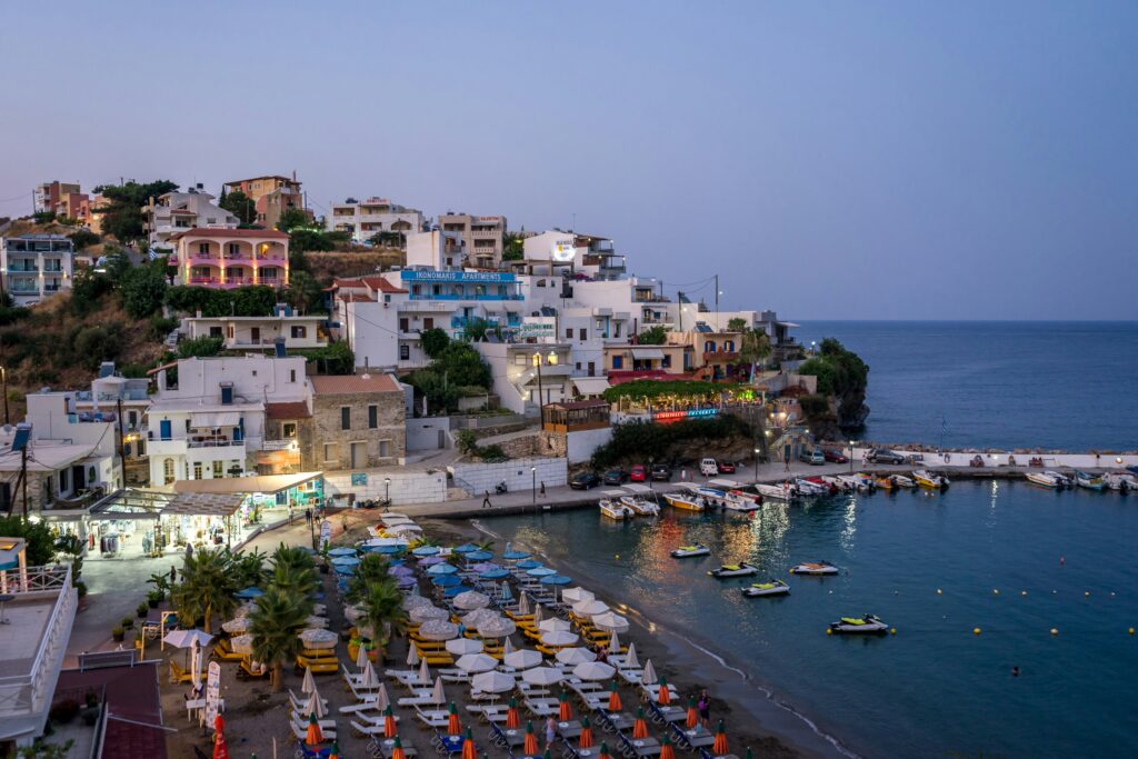 Sunset view of Bali Beach Rethymno by sunbeds