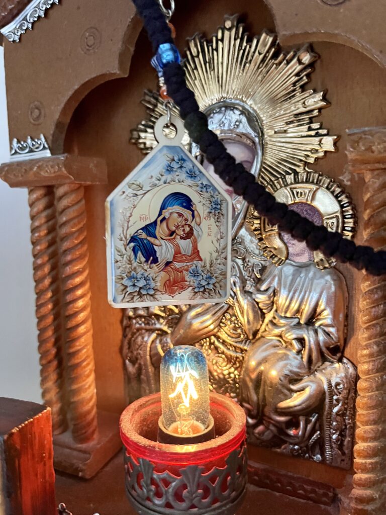 Home icons with light and Panagia