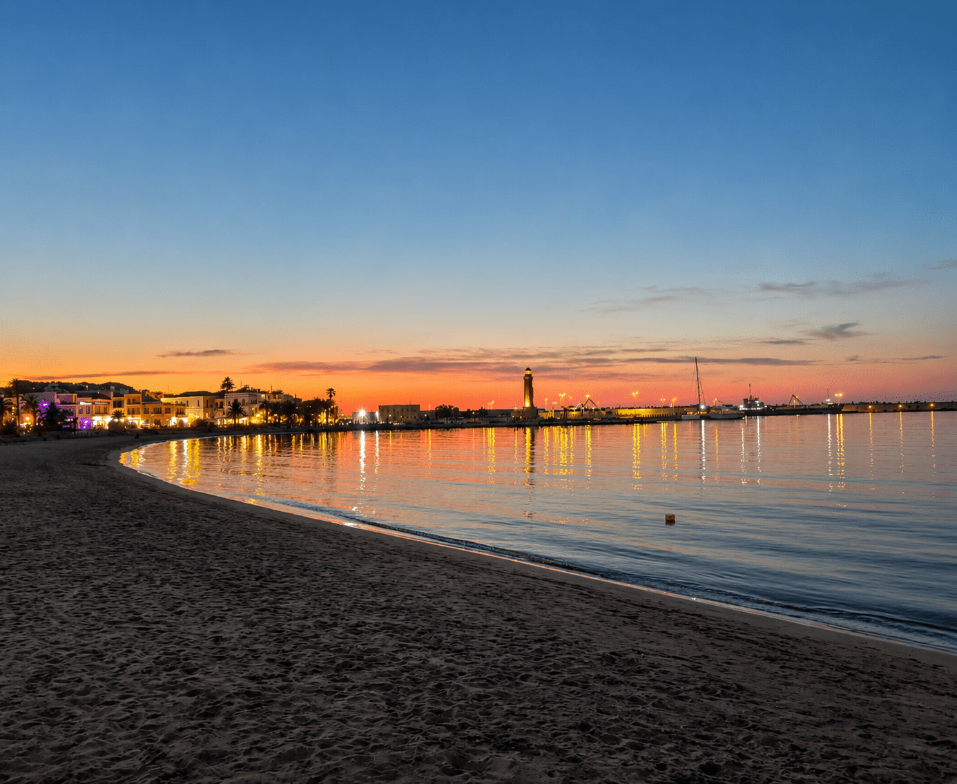 Rethymno beach in June with clear summer water